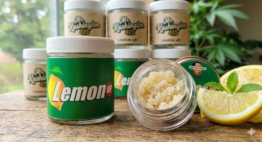 Squeeze the Day: Everything You Need to Know About the Lemon Up Strain Mr. Kushington 415 Lemon Up Solventless Hash Rosin with branded green labels and fresh lemon garnish